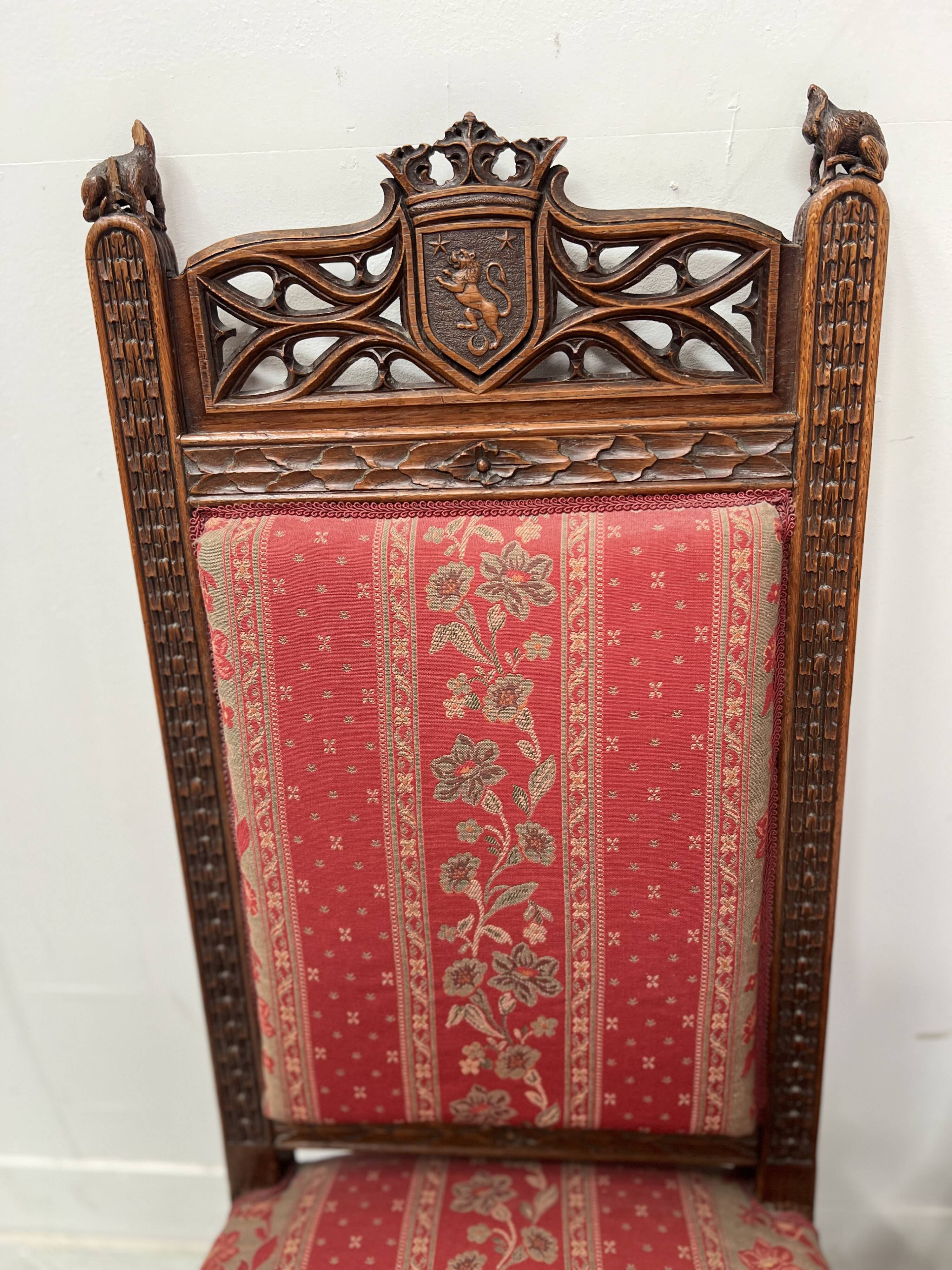 Pair of Gothic-style walnut lounge chairs, 19th century