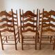 Set of 6 rustic-style chairs in wood and straw.