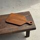 Rectangular solid teak chopping board with elongated handle 30x16.
