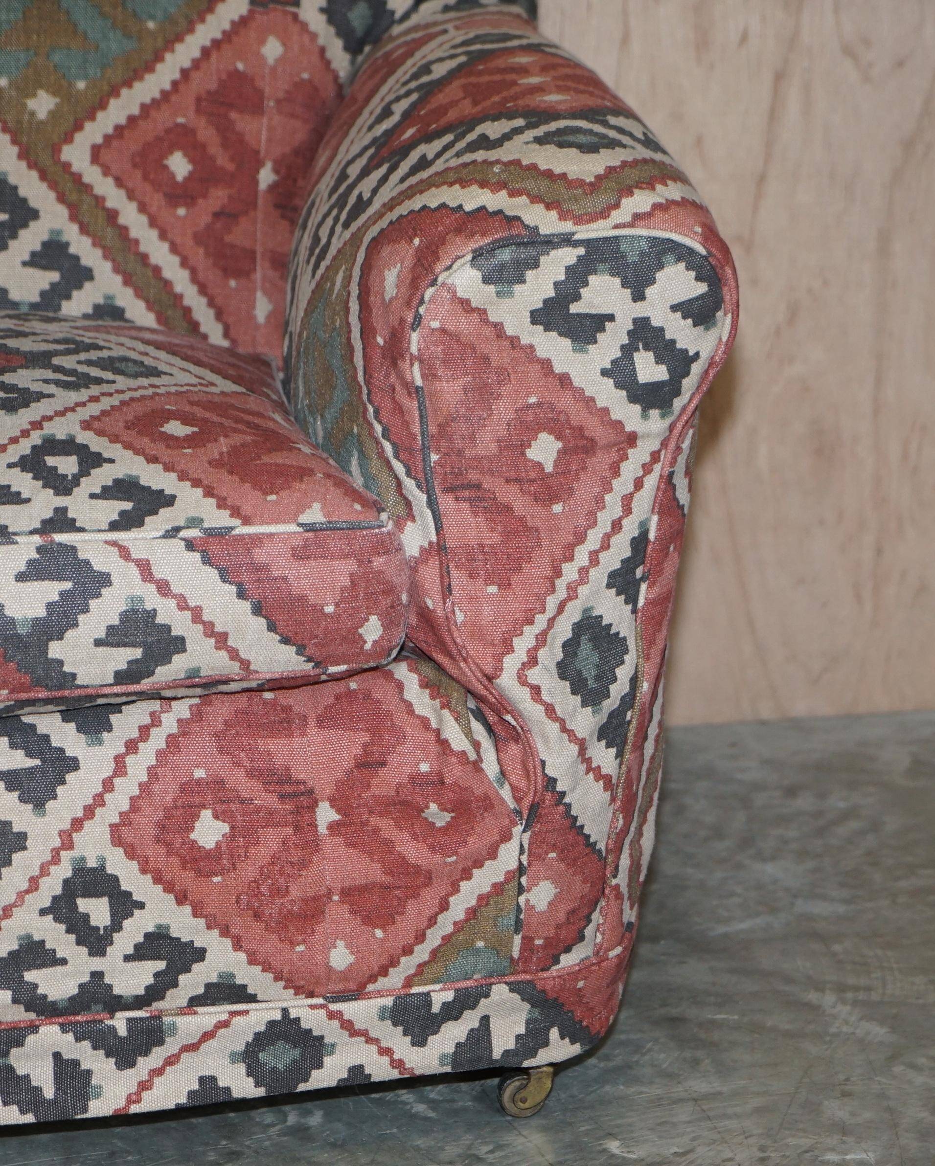 Victorian canapé upholstered in Kilim with turned mahogany legs.