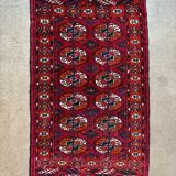 Bukhara rug with 12 panels in wool and burgundy silk, 88 x 54 cm.