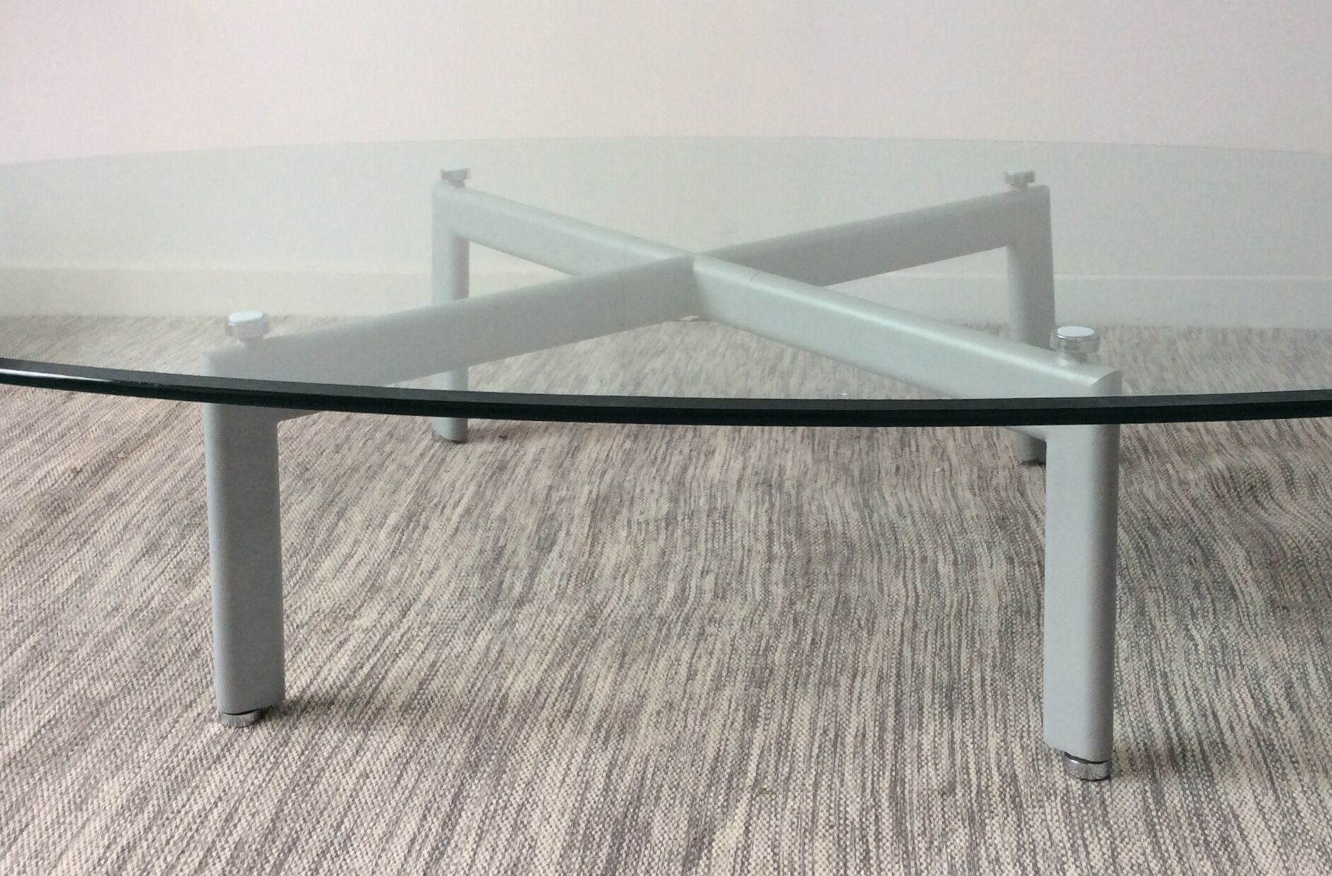 Design coffee table in beveled glass and steel foot