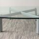 Design coffee table in beveled glass and steel foot