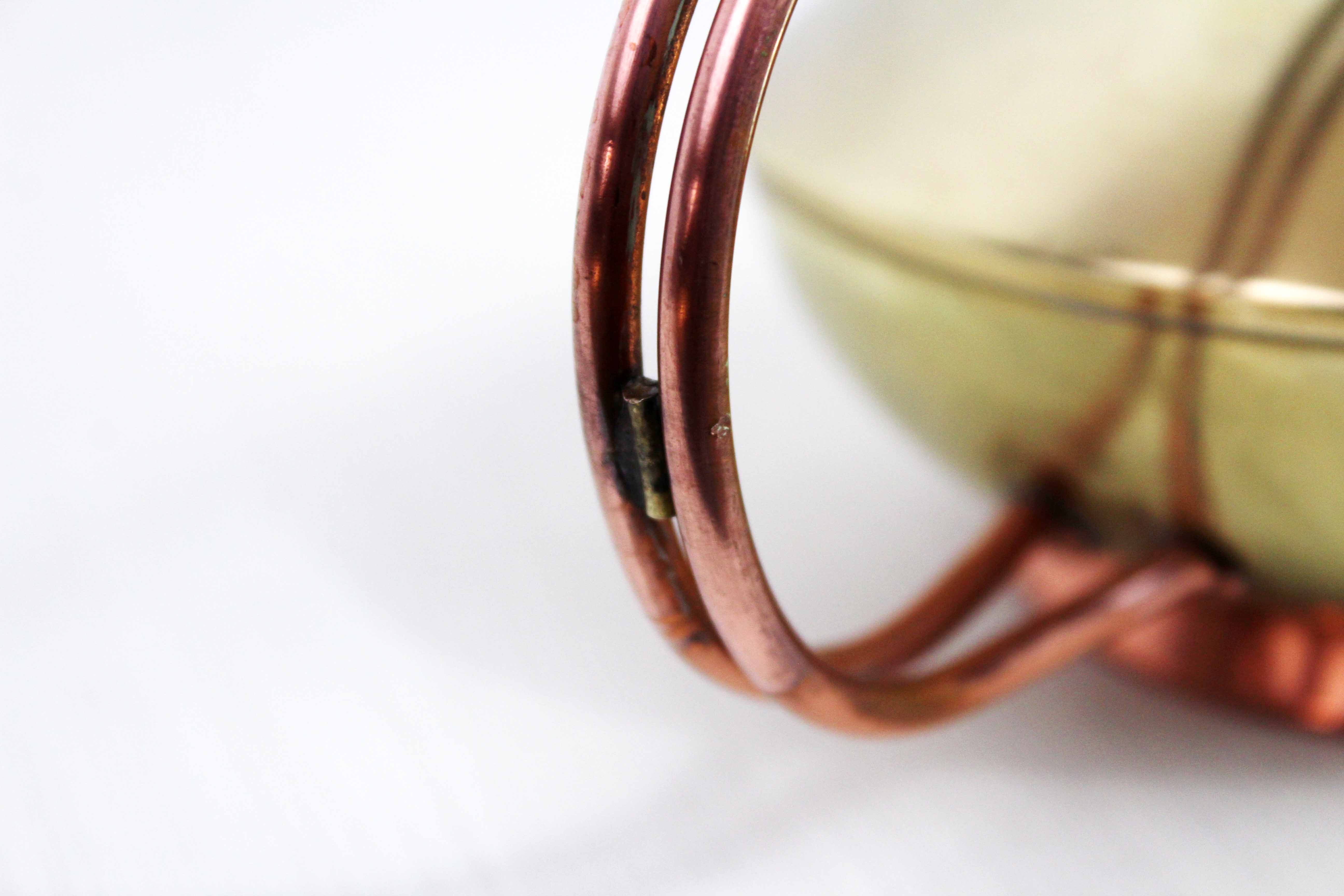 Watering can in brass and copper