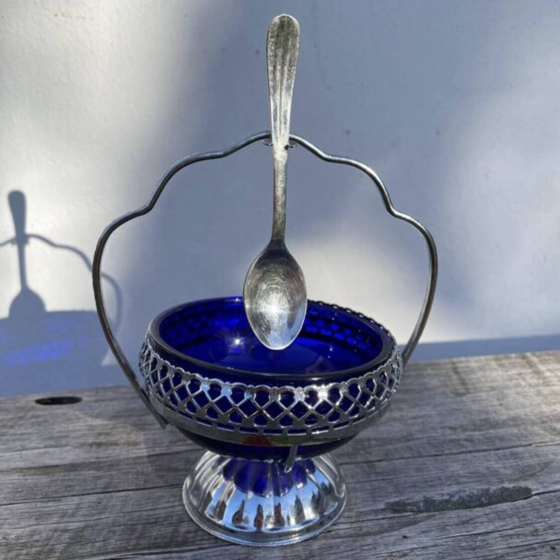Silver-plated metal and blue glass sugar and salt shaker