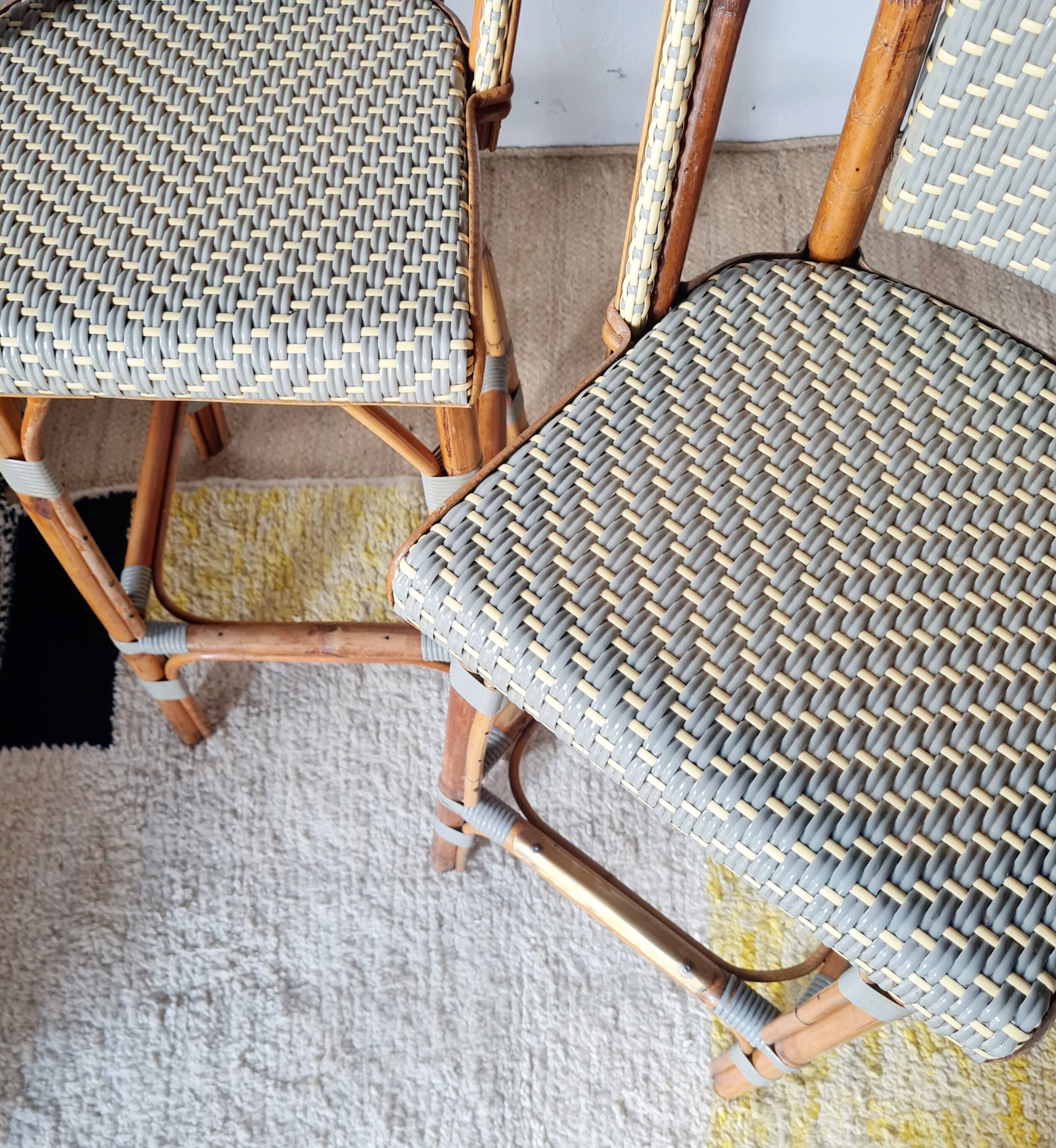 Pair of vintage Gatti bar stools in two-tone rattan and caning.