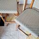 Pair of vintage Gatti bar stools in two-tone rattan and caning.