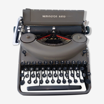 portable Remington typewriter with its suitcase and original cover