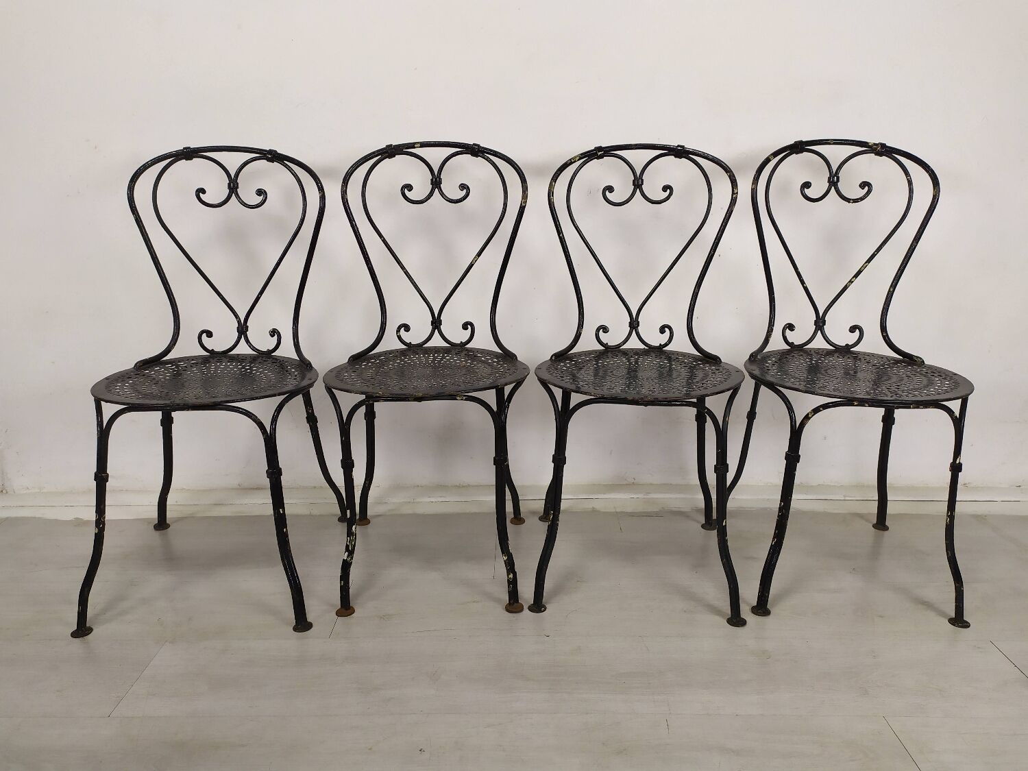 4 wrought iron garden chairs