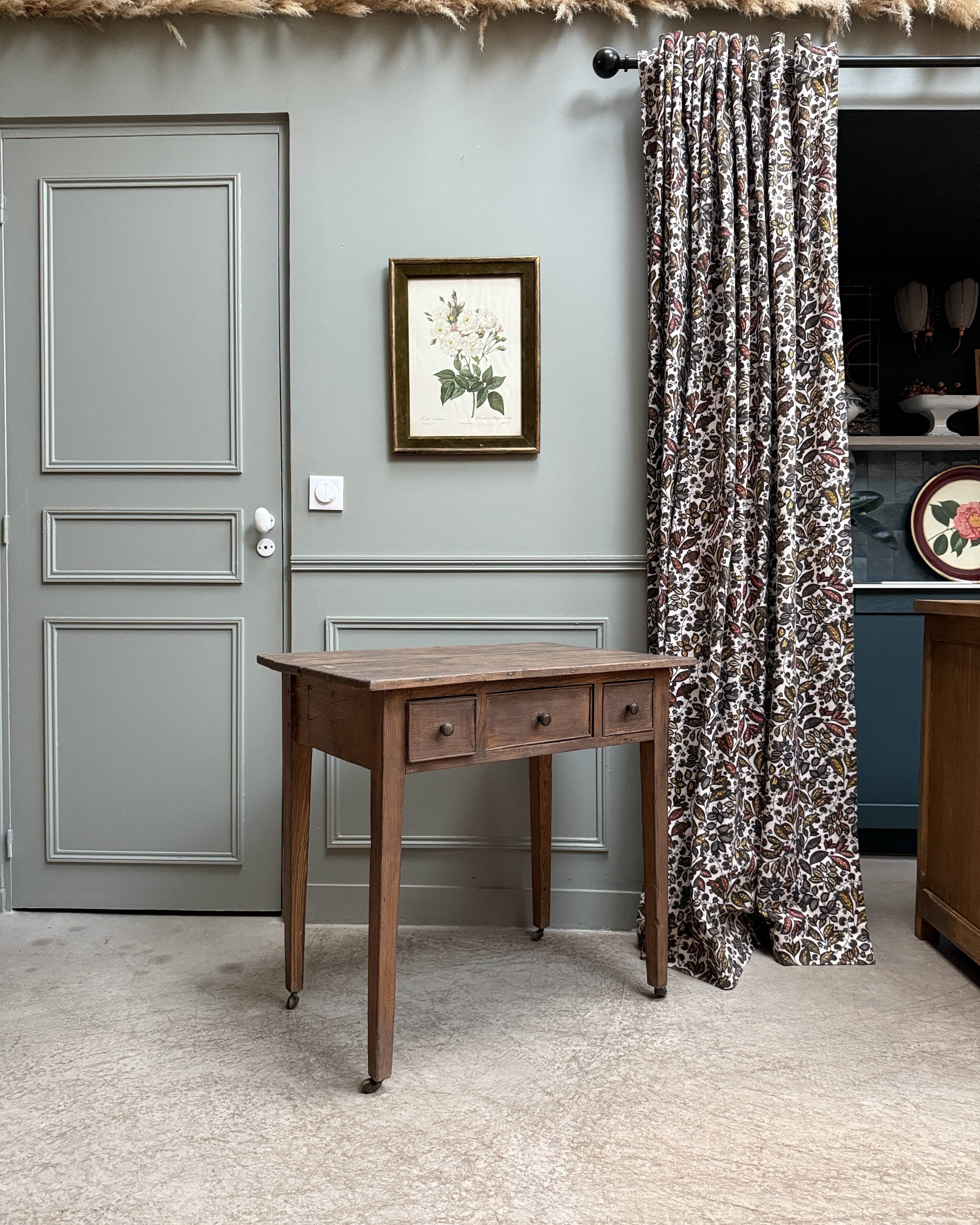 Small antique desk on wheels