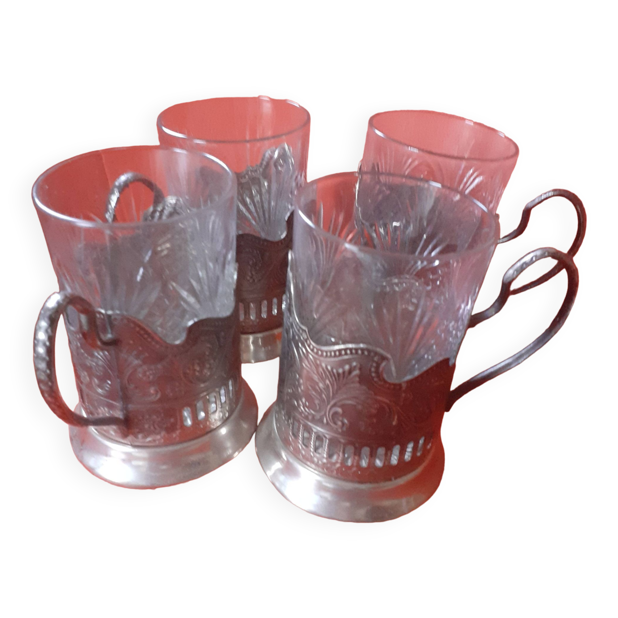 4 glasses engraved on their silver metal support;