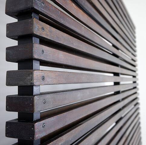 Slatted wood panel room divider or slatted coat rack with 10 mobile hooks