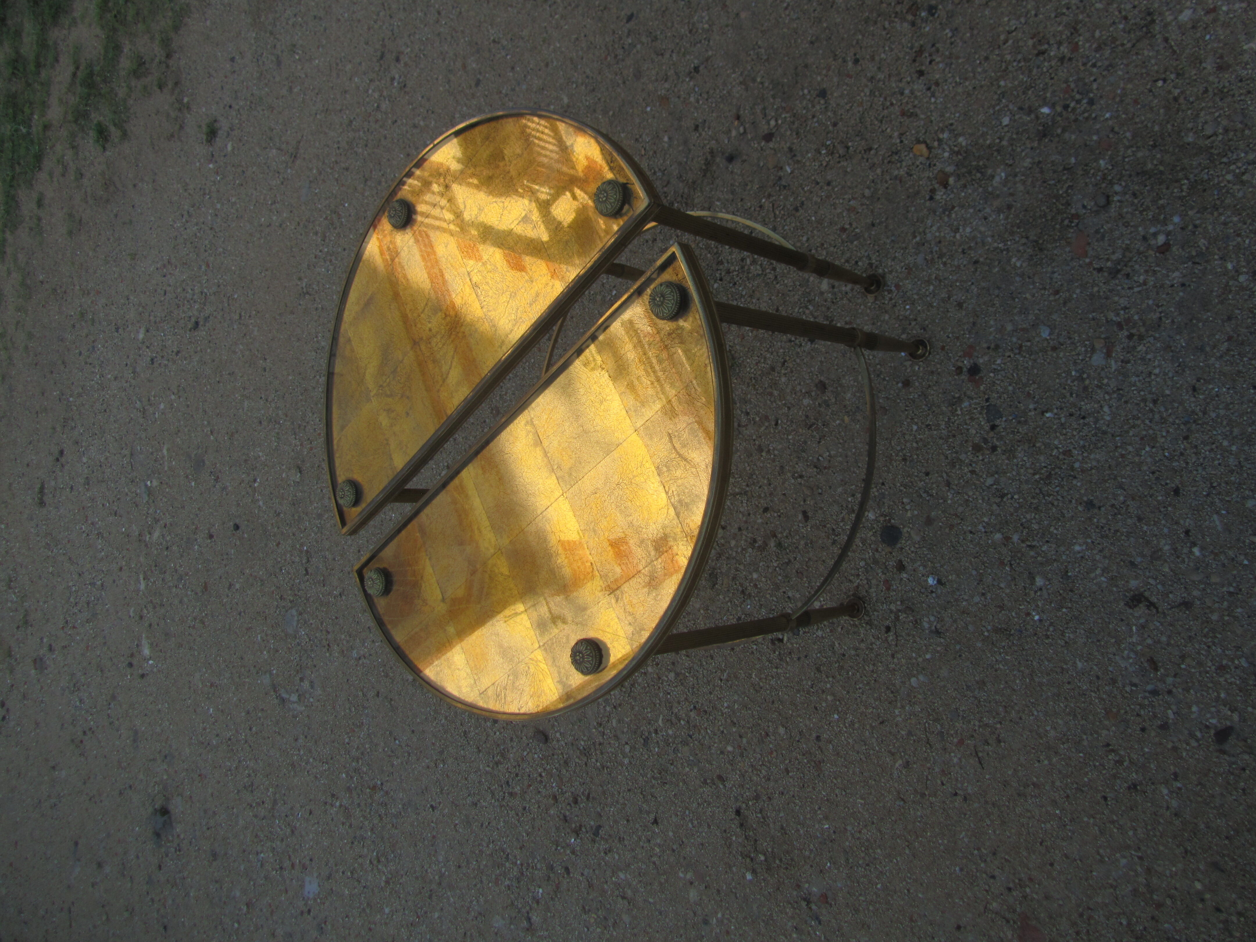 Pair of sofa tips, gilded bronze and 50s glass