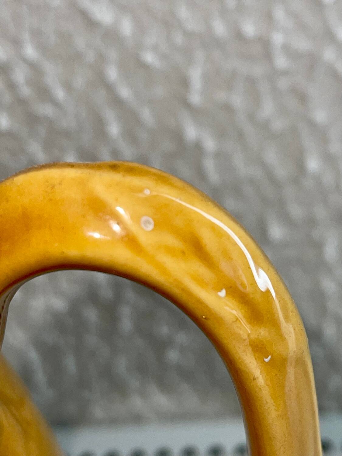 Antique pitcher with flower decoration