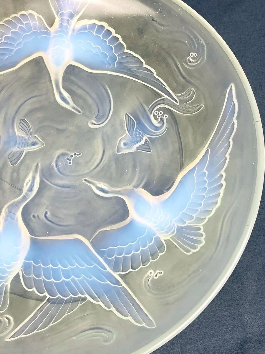 Verlys, iridescent glass cut with a design of geese and fish.
