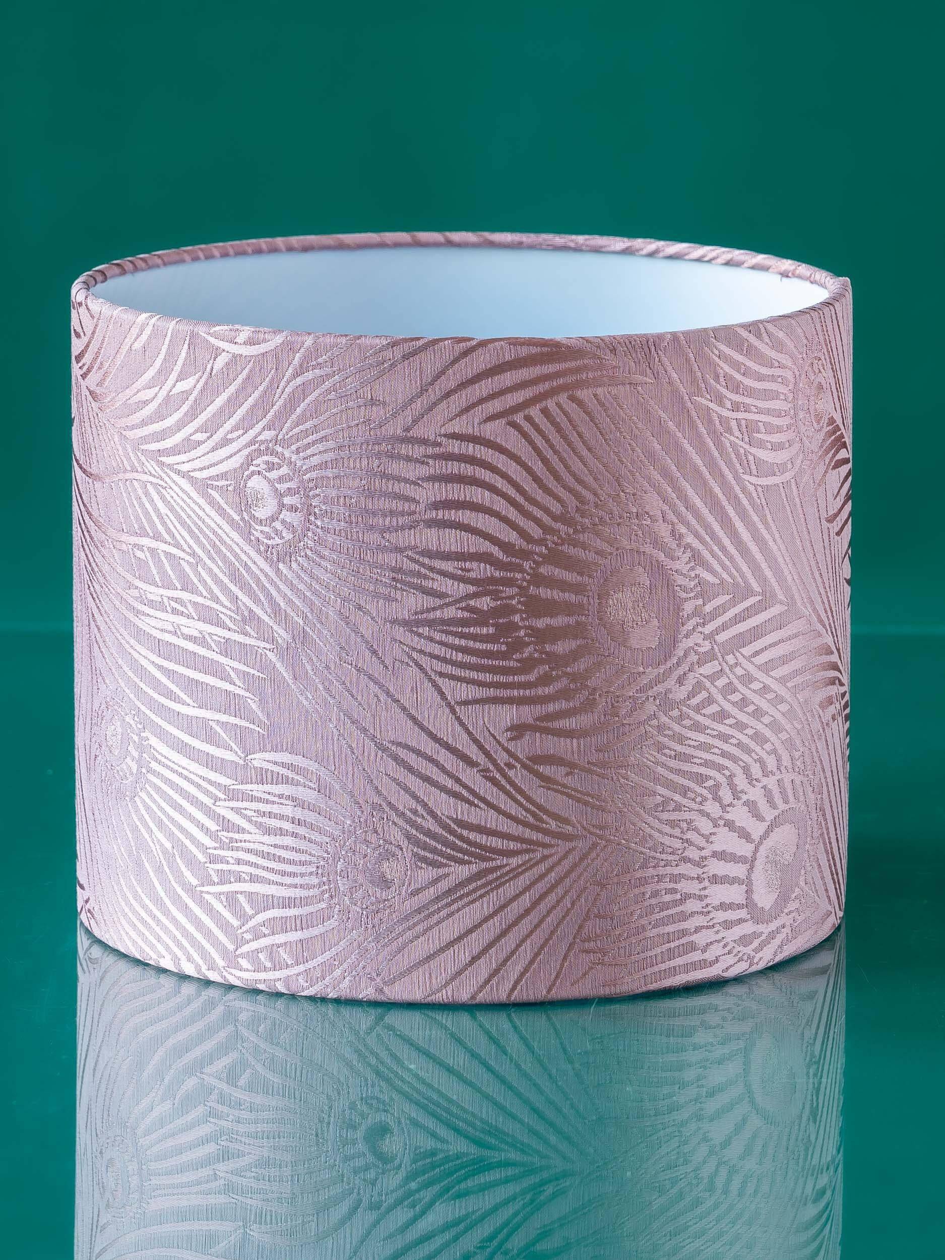 Royal Delft blue-green ceramic table lamp with pink jacquard peacock shade.