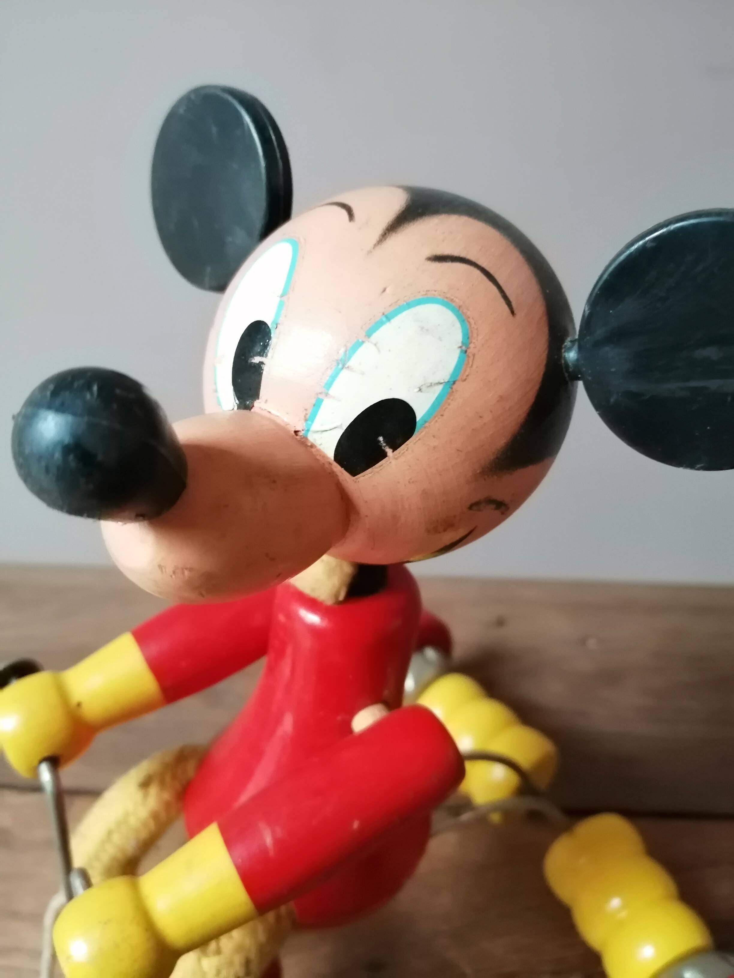 Old Mickey Mouse toy on his wooden tricycle