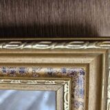 Golden wooden frame with floral patterns