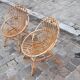 Pairs of shell rattan armchairs from the 50