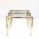 Brass and glass trundle tables