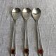 Art Nouveau metal and amber spoons