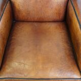 Art Deco design sheepskin leather armchair with a stunning patina
