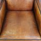 Art Deco design sheepskin leather armchair with a stunning patina