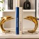 Dolphin bookends in gold metal and plexiglass – 1980s