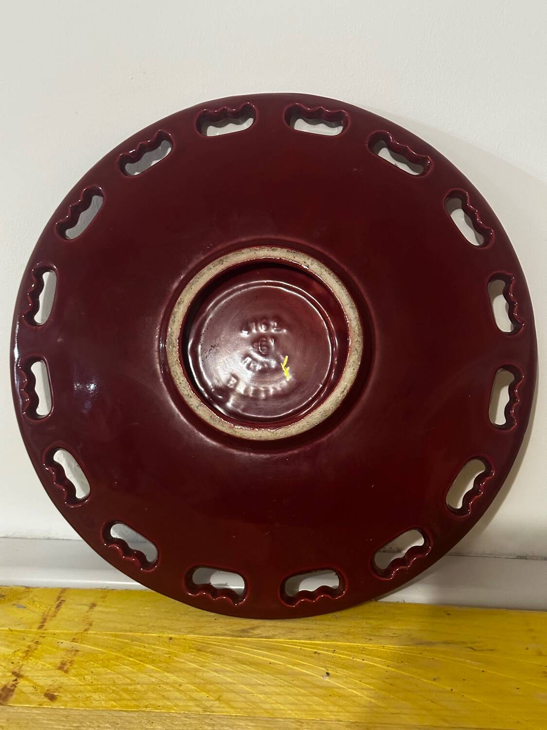 Burgundy and gold openwork plate in ceramic from Saint-Clement, 1950s.