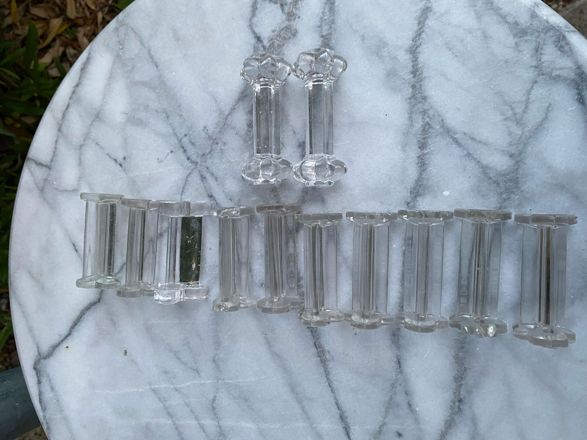 Set of 12 vintage glass knife rests in clear moulded glass.