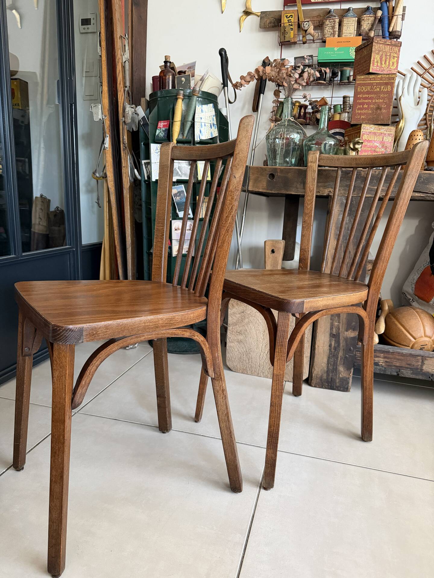 Pair of vintage Baumann bistro chairs in wood.