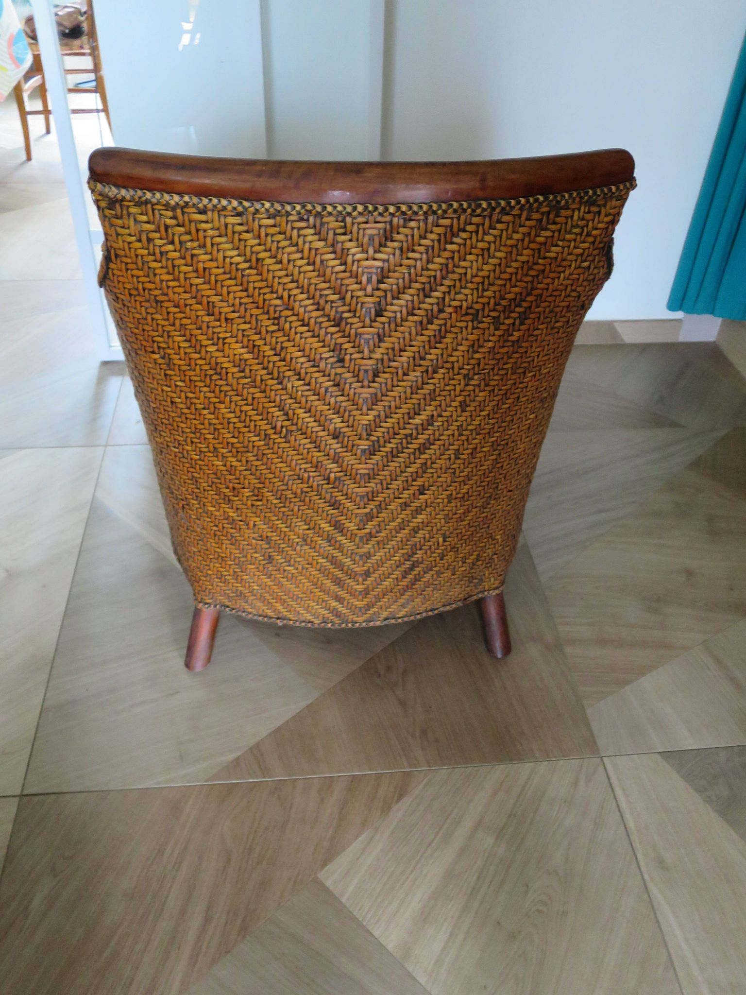 Woven rattan armchair and exotic wood in colonial style, 1980s.