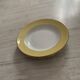 White and pastel yellow Amandinoise plates