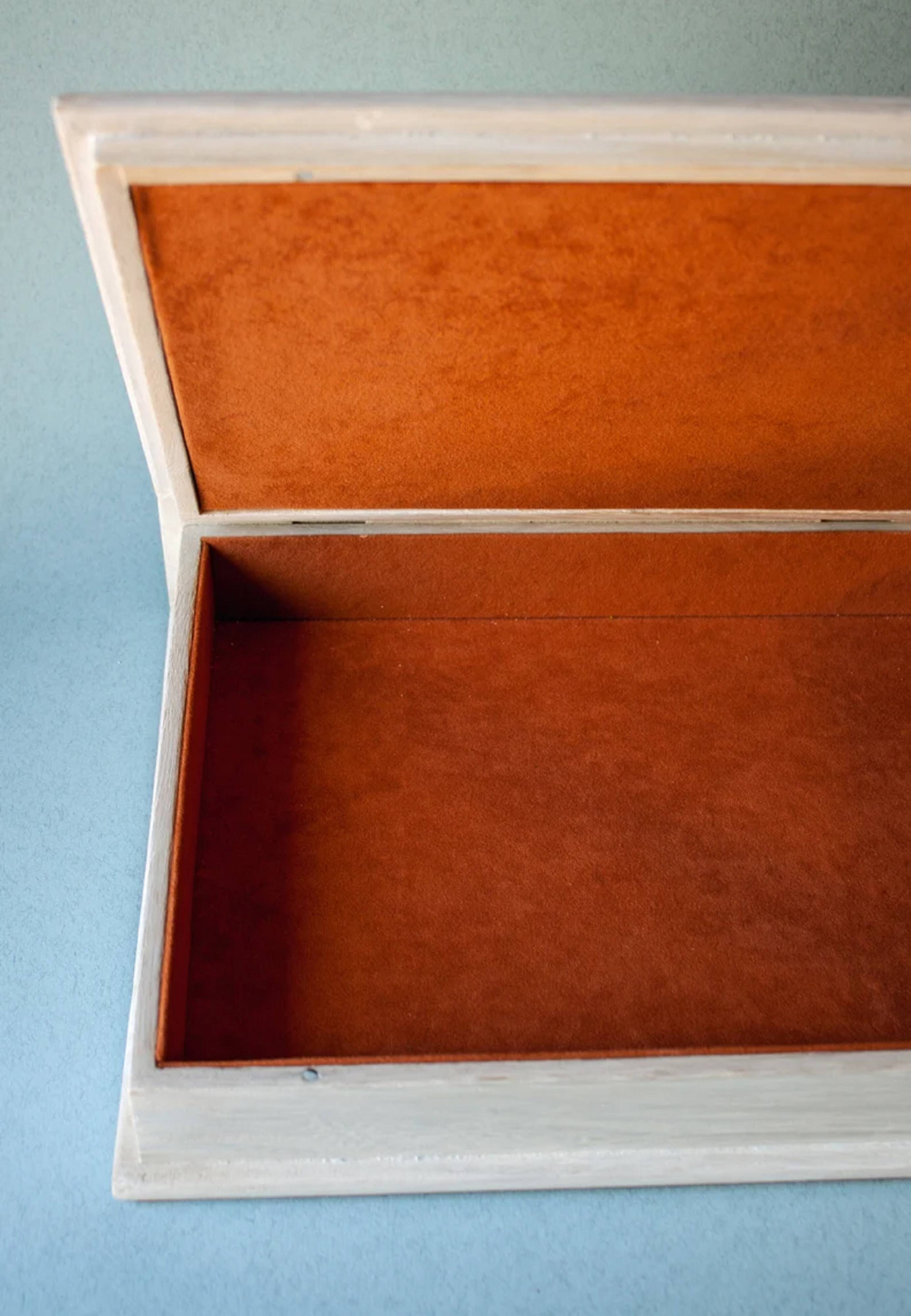 White wooden boxes decorated with Catalan trencadís style mosaics