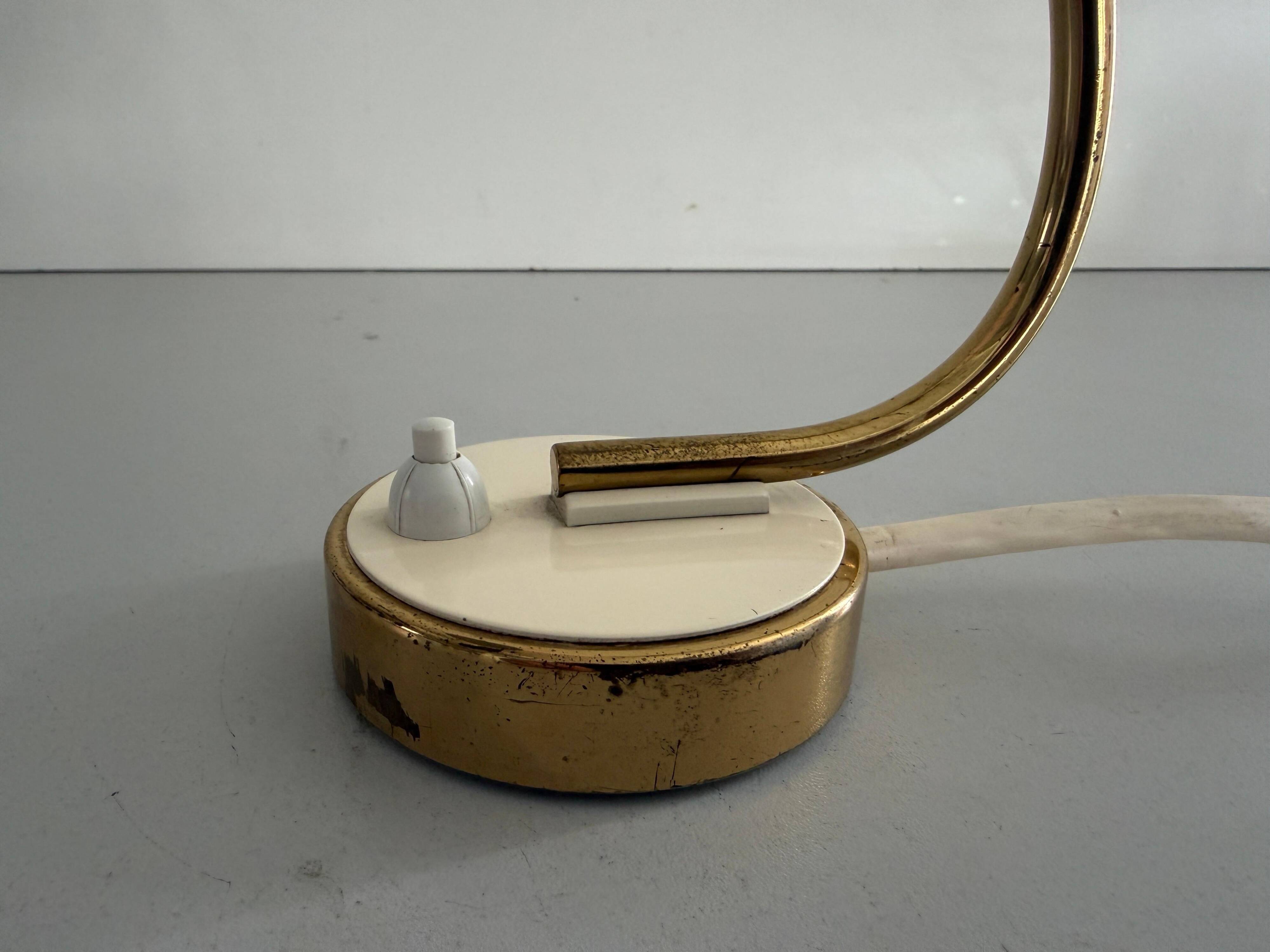 Simple table lamp with a pink metal head and brass body, 1960s, Germany.