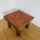 Table carreaux rouge signée