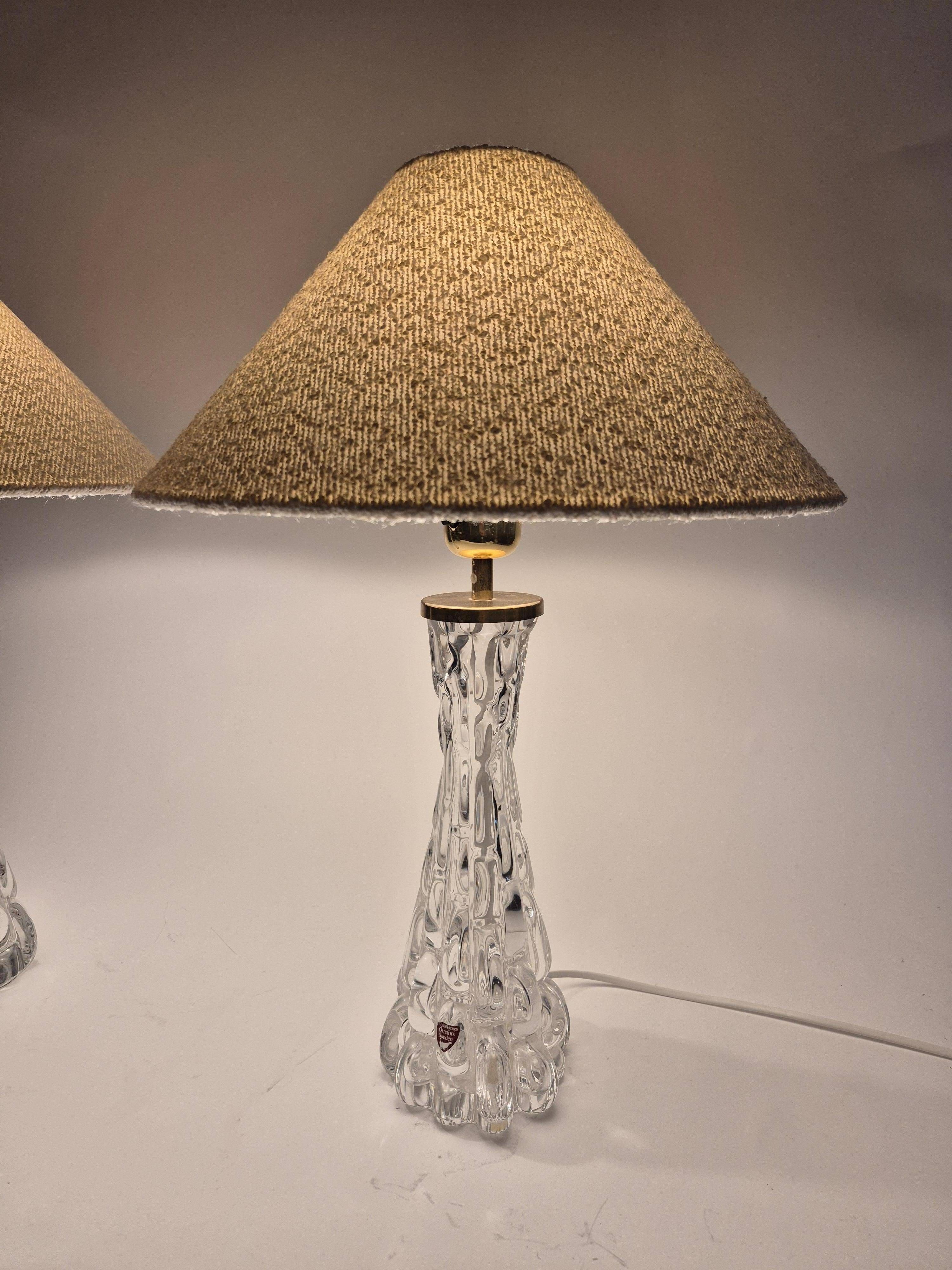 Elegant pair of table lamps The Modern Scandinavian Modern with Orrefors glass and brass.
