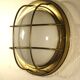 Brass "porthole" wall lamp