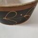 Vintage dish with black and ochre decoration and a speckled crackled interior – 1970s