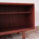 Teak enfilade, sliding doors, black faux leather top, 1970s.