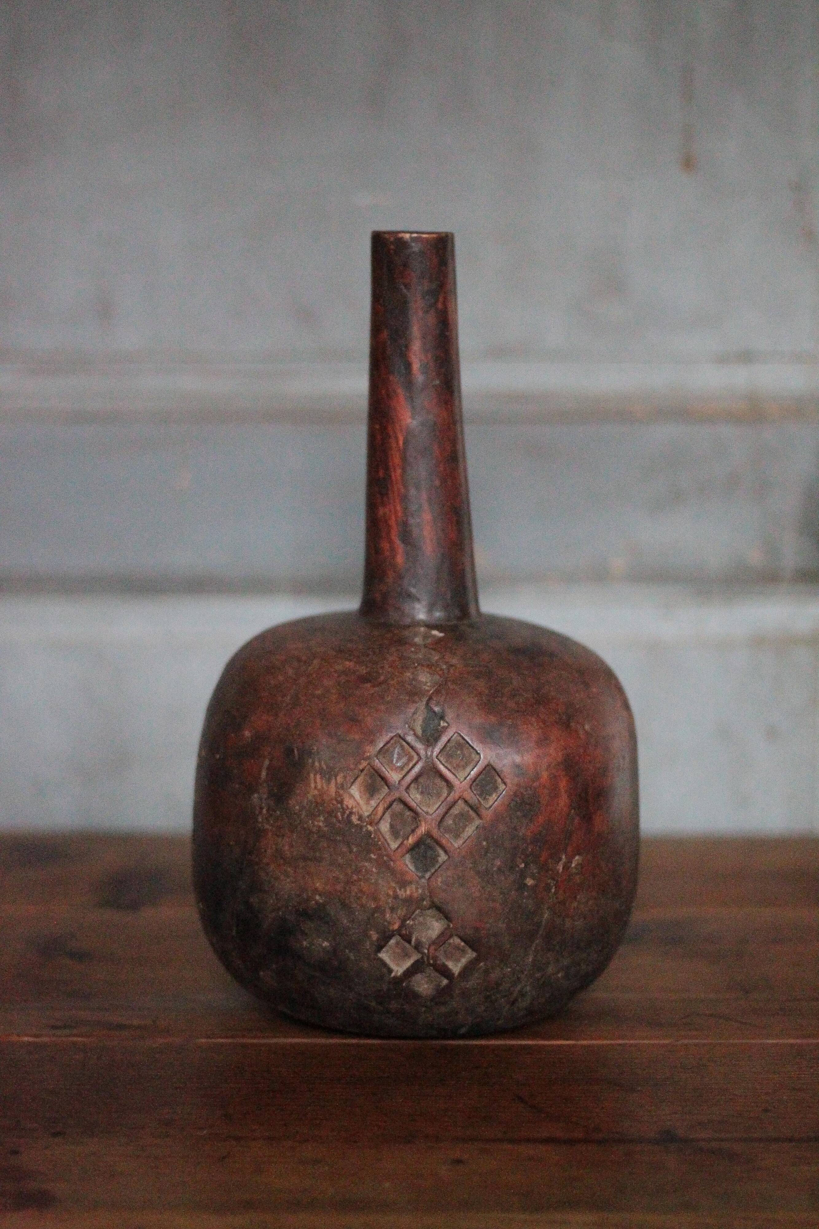 Vintage African wooden carved gourd bottle.