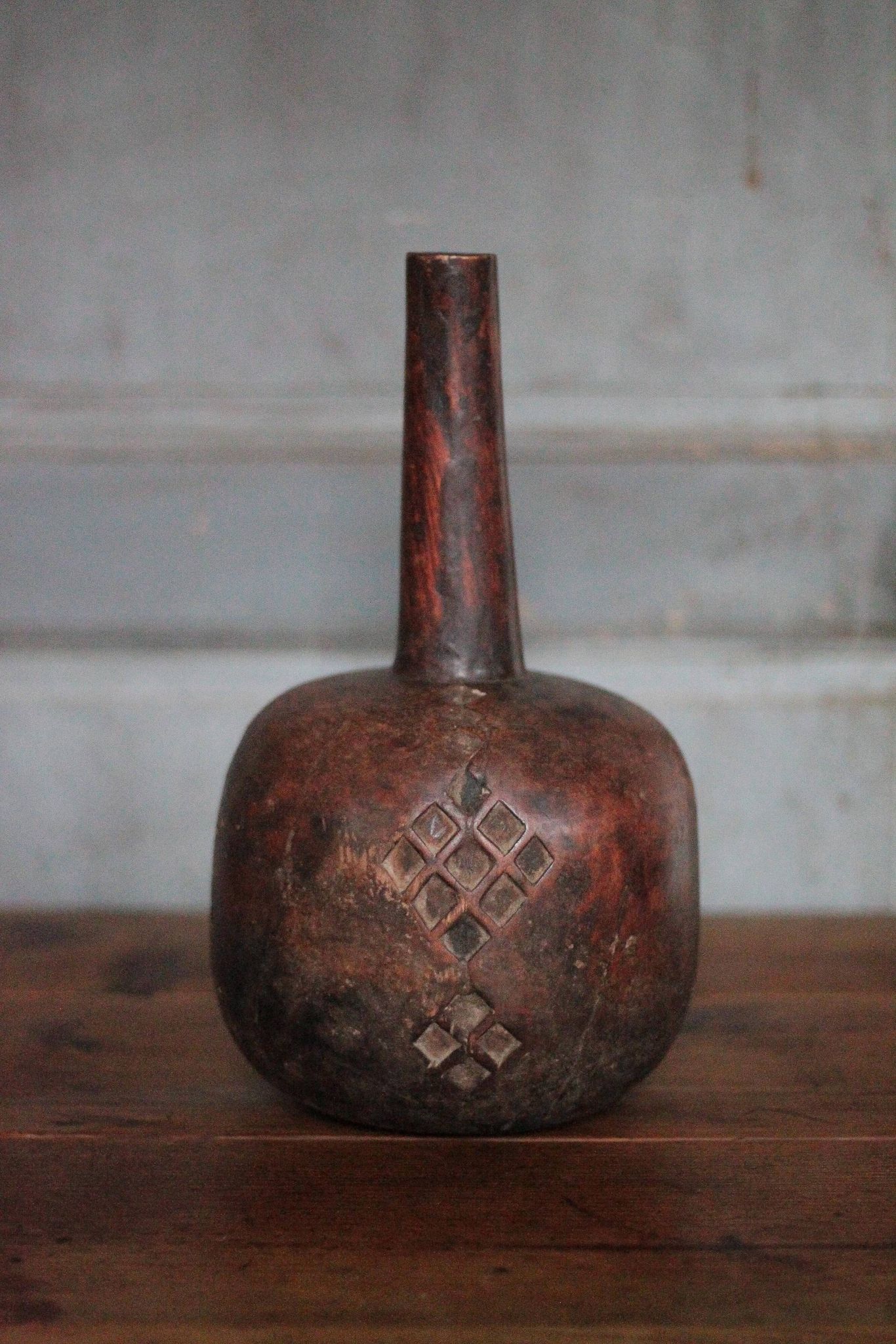 Vintage African wooden carved gourd bottle.