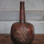 Vintage African wooden carved gourd bottle.