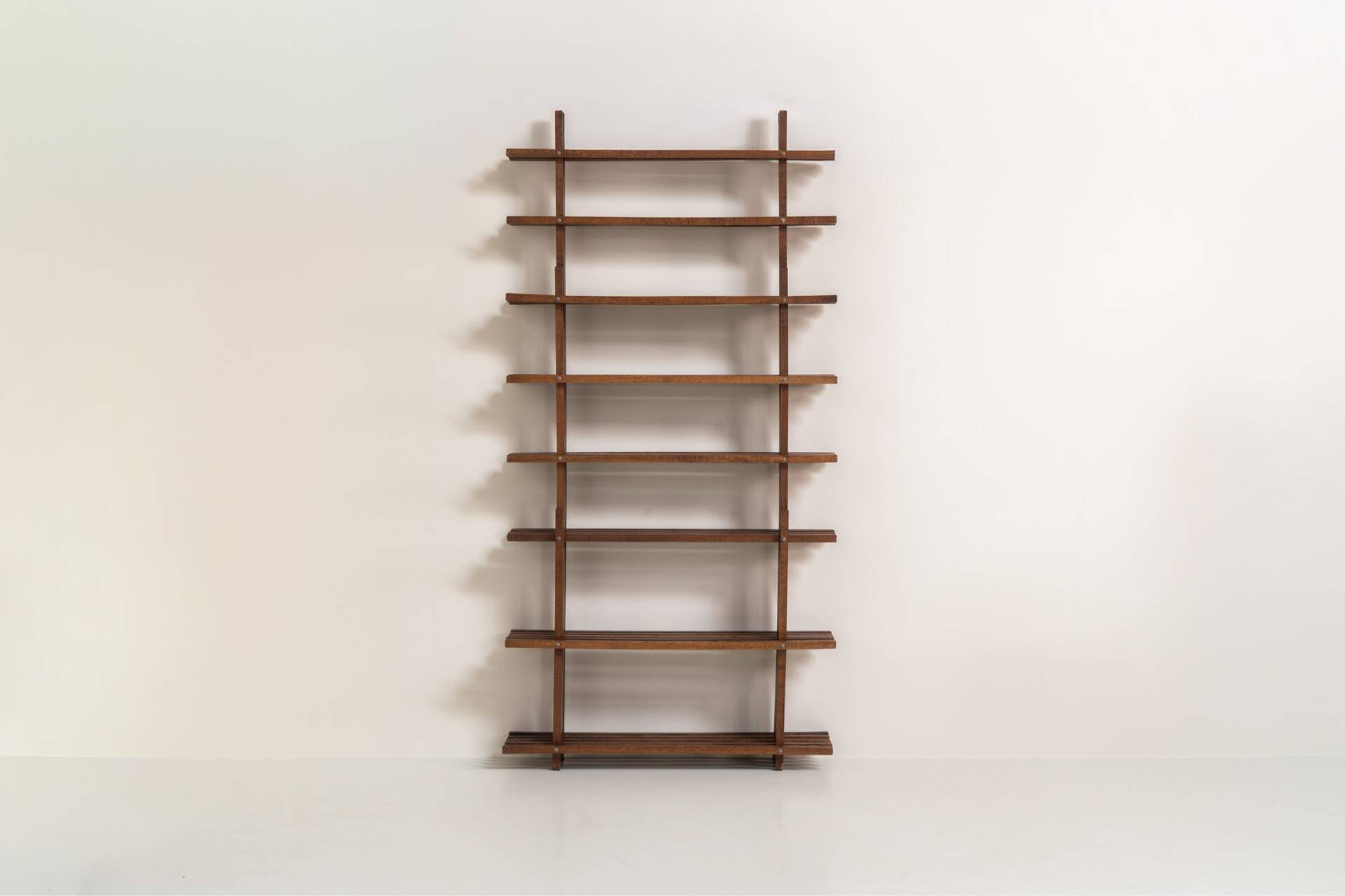 Sculptural wengé slat bookcase (Europe, 1960s).