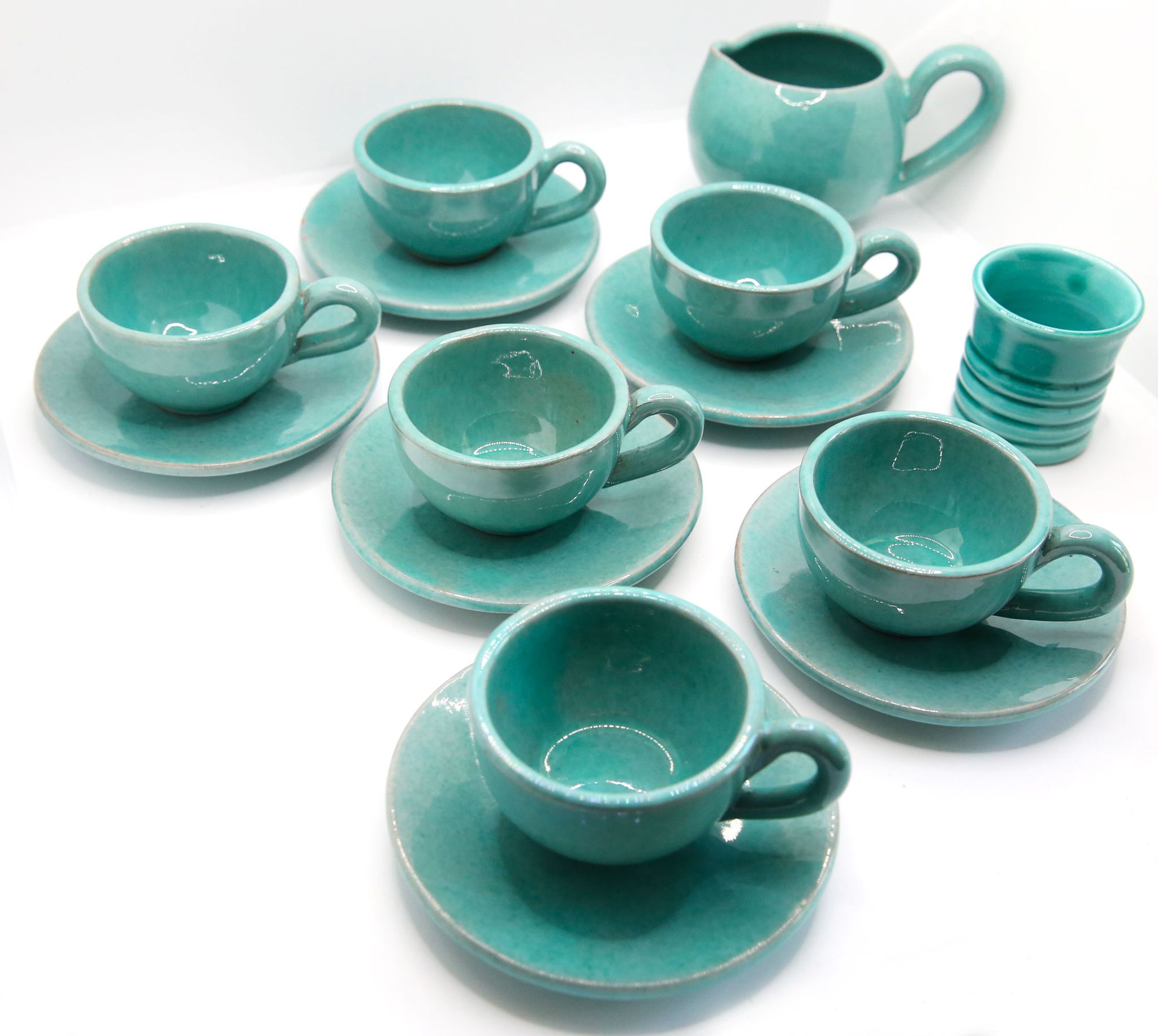 Set of 6 cups in turquoise blue enamelled earth with their saucers and milk jar