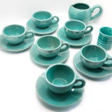 Set of 6 cups in turquoise blue enamelled earth with their saucers and milk jar