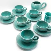 Set of 6 cups in turquoise blue enamelled earth with their saucers and milk jar