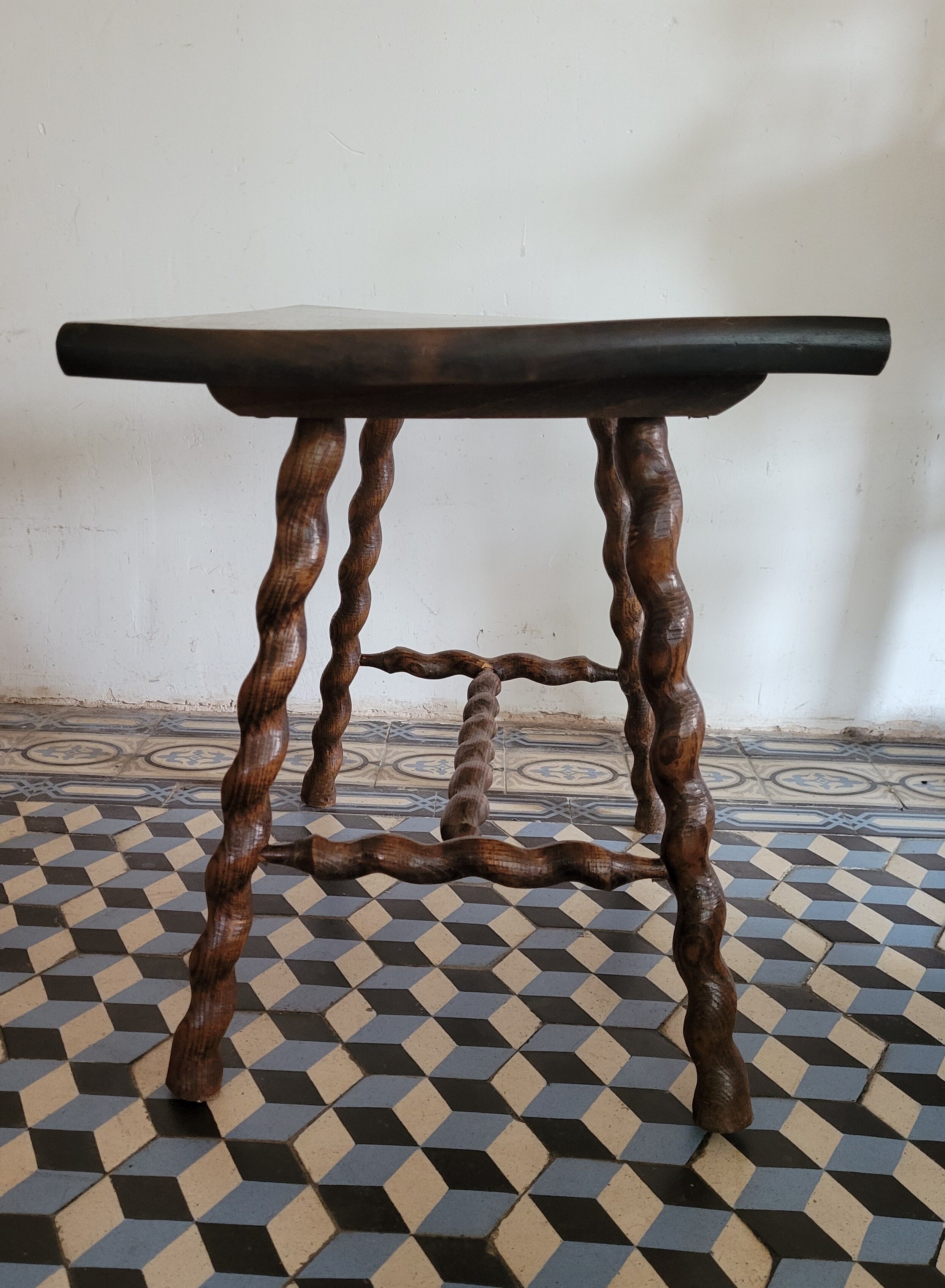 Brutalist coffee table with turned wooden legs