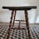 Brutalist coffee table with turned wooden legs
