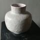 Vase covered white crusty and cracked ceramic,